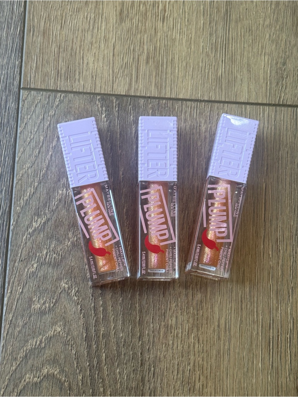 MAYBELLINE Lilac-Top Glossy Lip Plump Trio - Shimmery Peachy Gold.
